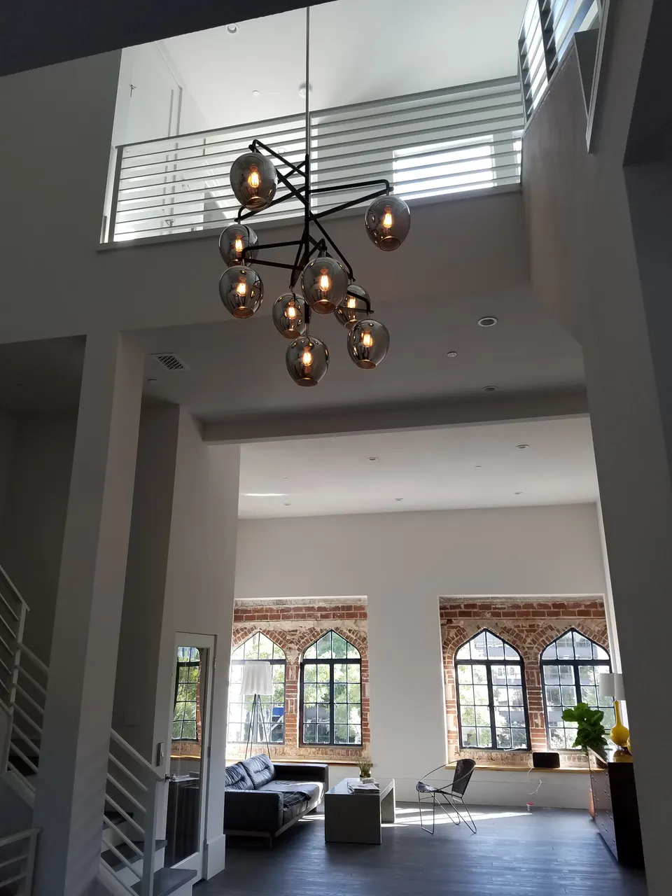 Custom sputnik chandelier installation in a historic Orlando residence