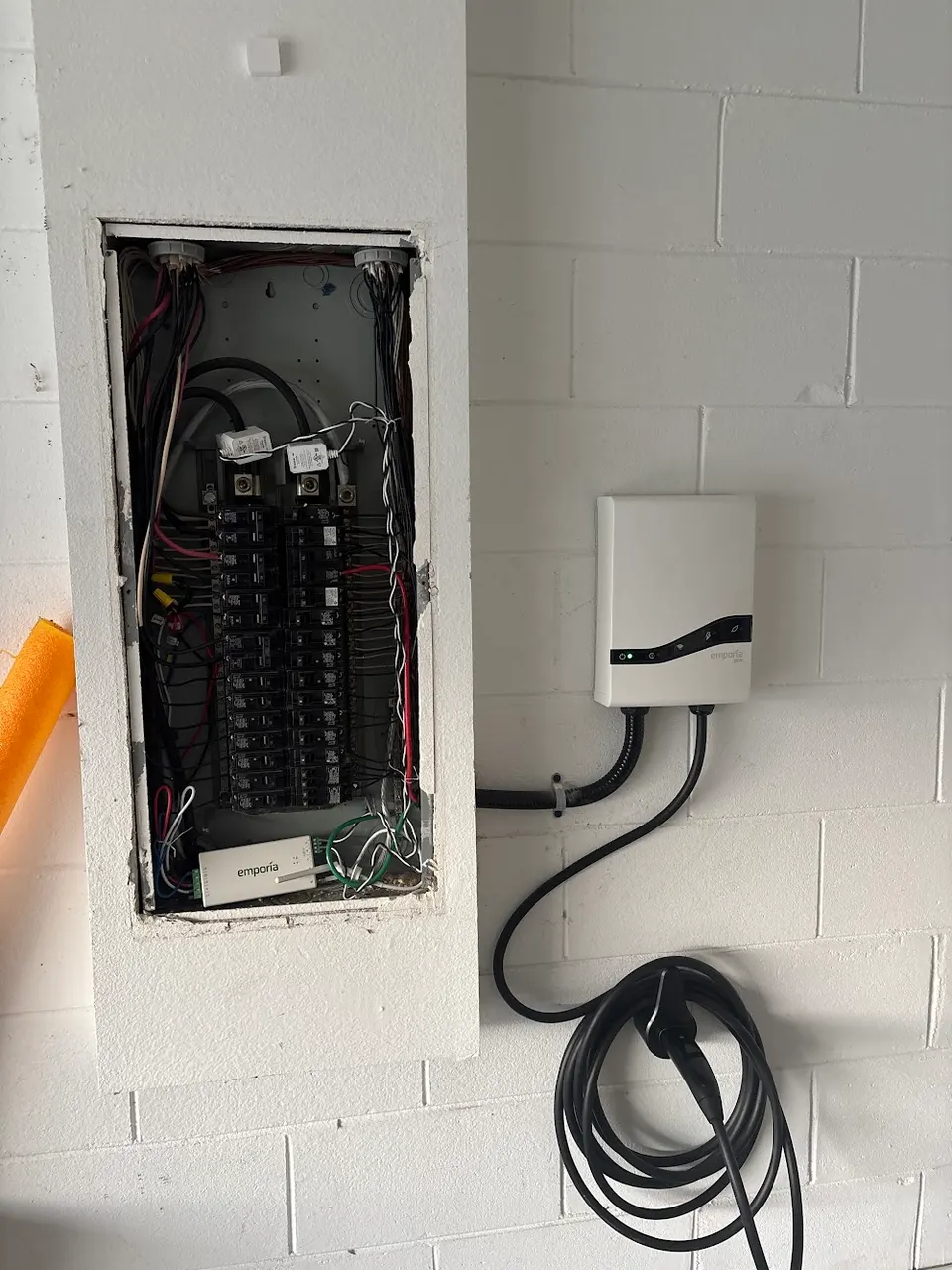 Level 2 EV charger mounted in a garage by In Phaze Electric
